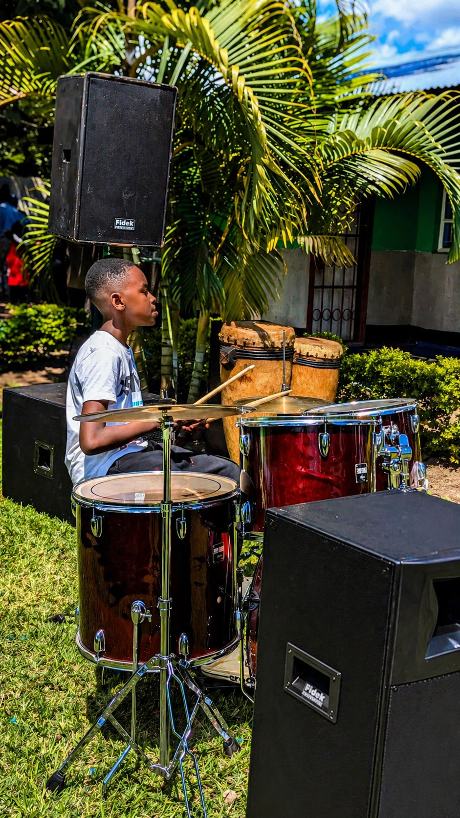 A young learner performing on the drums at a school event